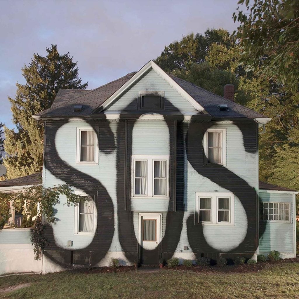 Houses like a canvas, street art by Ian Strange | Collater.al